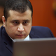 George Zimmerman looks at information on a laptop during jury selection in his trial in Seminole circuit court in Sanford, Fla., June 20, 2013. A judge in Florida has dismissed a defamation and conspiracy lawsuit former neighborhood watch volunteer George Zimmerman had filed against the parents of Trayvon Martin, the teen he fatally shot almost a decade ago in a case that drew international attention about race and gun violence.